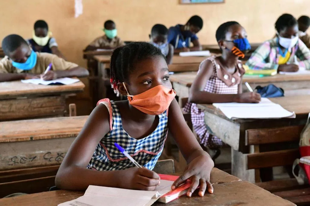 A classroom filled with young black school children